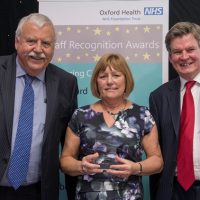 Picture of Lynda Coles with Chief Executive Stuart Bell CBE and Chairman Martin Howell