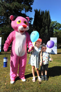 The Oxford Health Charity's Healthfest 2019 at The Warneford Hospital, Oxford. The Pink Panther Mascot with Flo and Nelson Shipp, aged five and two and three-quarters respectively.