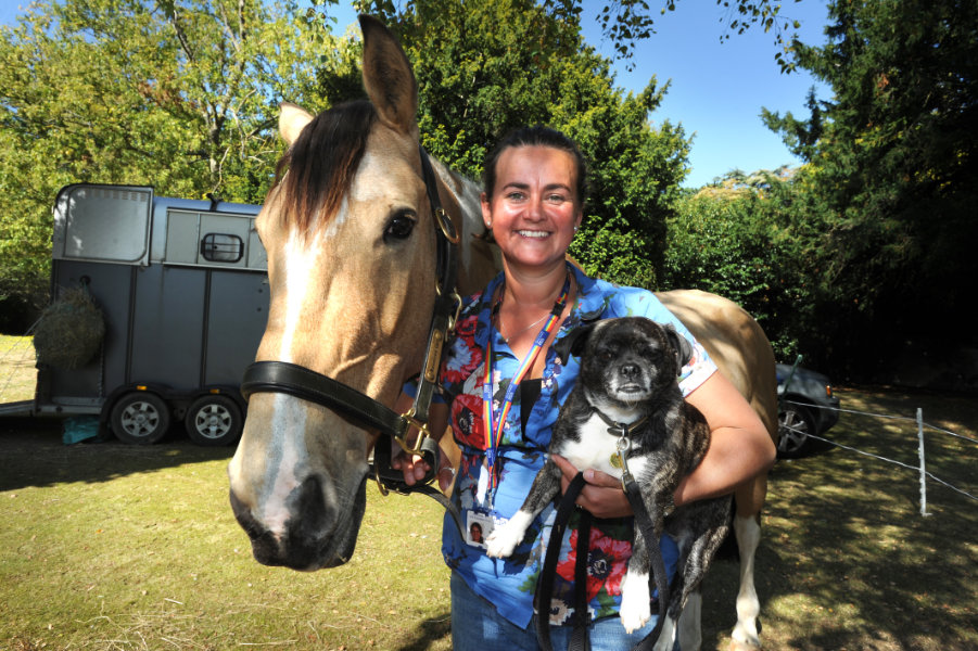 The Oxford Health Charity's Healthfest 2019 at The Warneford Hospital, Oxford. Patient experience and involvement team manager Donna Mackenzie-Brown with her horse Rosie and 'pat dog' Roxy.