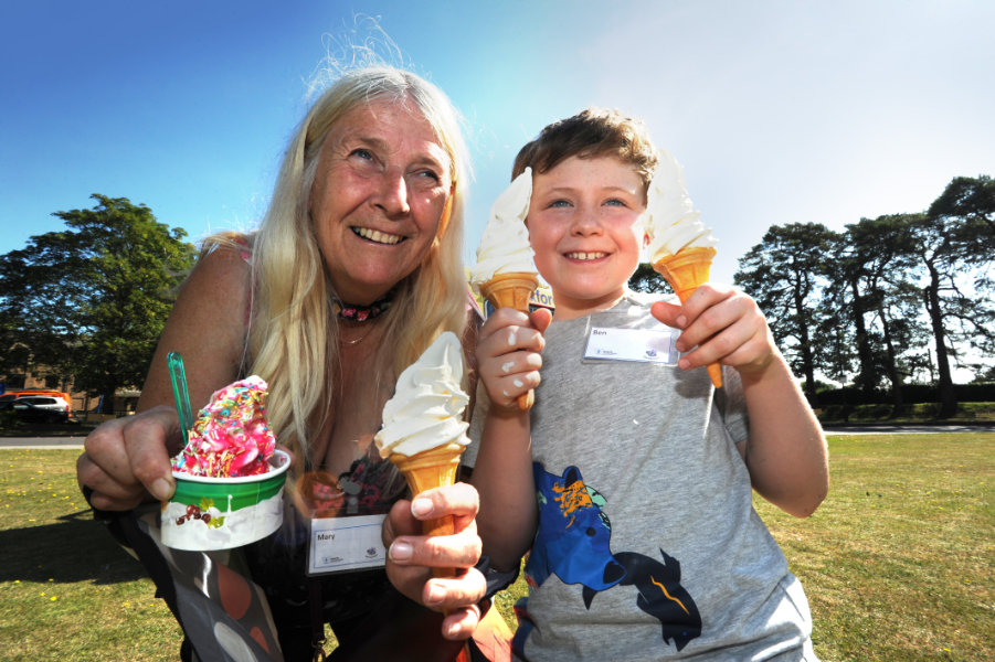 The Oxford Health Charity's Healthfest 2019 at The Warneford Hospital, Oxford. Mary Bowles and eight-year-old Ben Wade tppk a break from the Butterfly Conservation stand to buy ice creams.