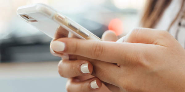 Photo of a woman making a phone call.